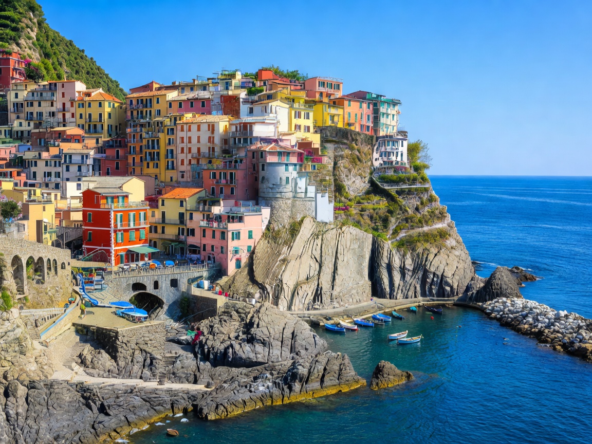 Colorful cliffside Italian coastal town overlooking blue Mediterranean waters